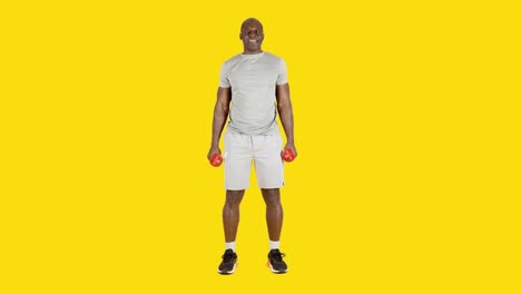 african man doing curl biceps exercise with dumbbells alternating arm