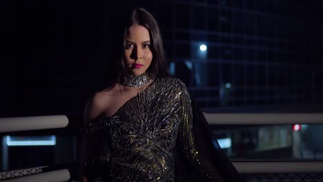 young latina on the stairway of an overpass in a sparkle dress in the city of port of spain, trinidad