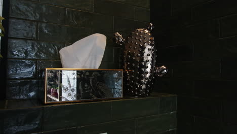 stylish bathroom decor with tissue box and cactus