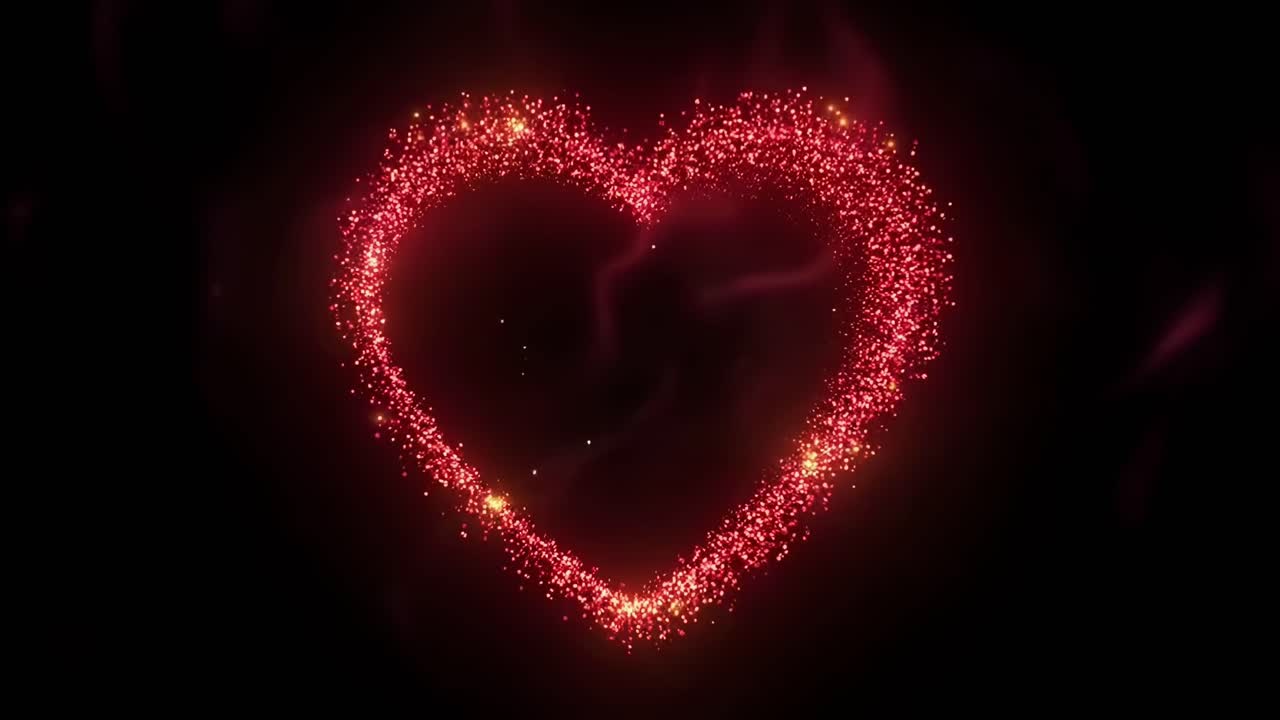 Vista aerea di un effetto di scintille a forma di cuore su sfondo nero, ideale per video romantici, Live