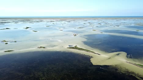 aerial view of shallow sea and many islands