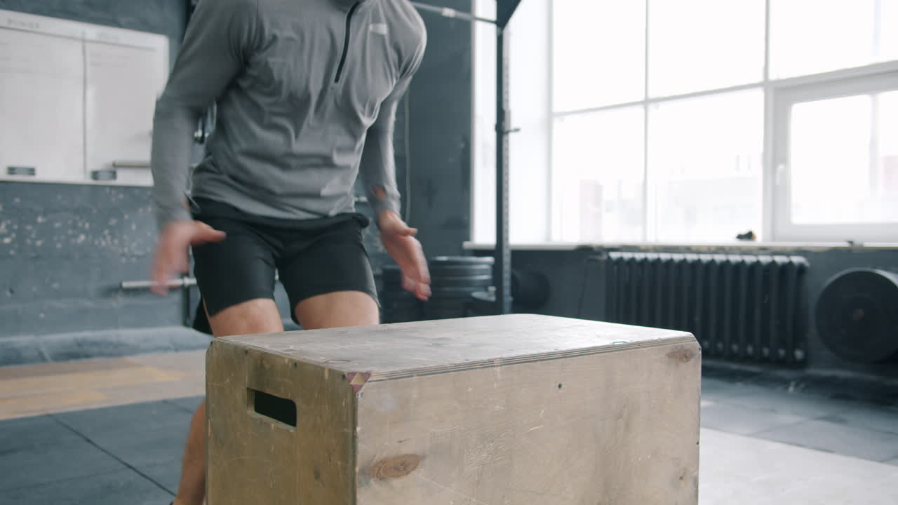 Box Jump Exercise in Gym