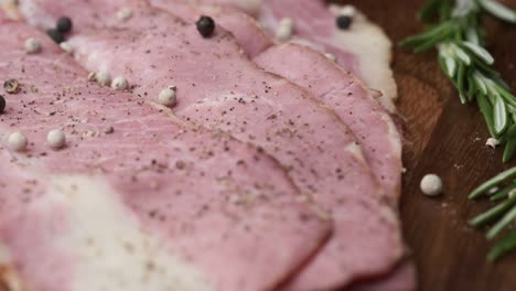 sliced smoked ham with rosemary and spices