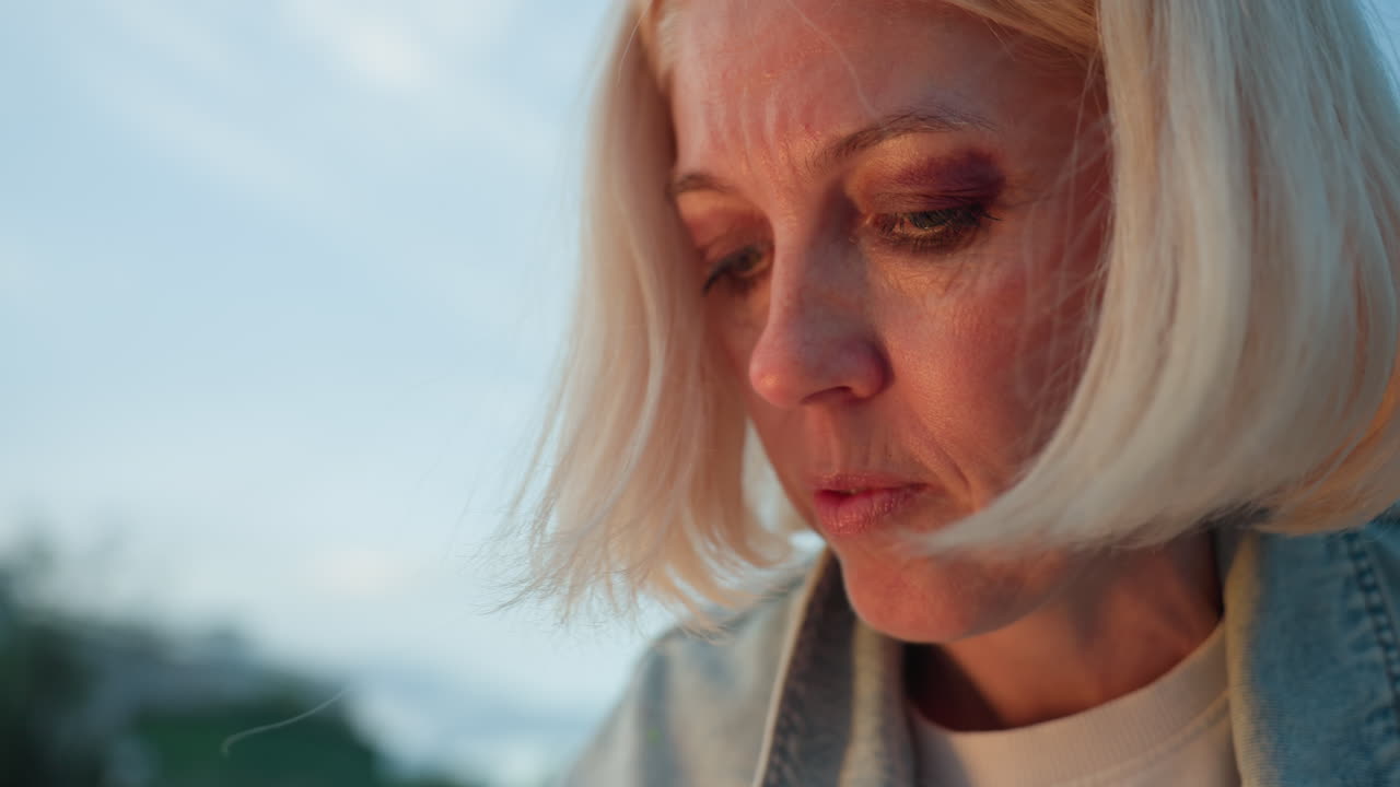 close up elegant mother with bob haircut deeply concentrating on painting, warm sunlight illuminating cheek bone and hair strands, gentle breeze moving locks, serene creative expression on canvas