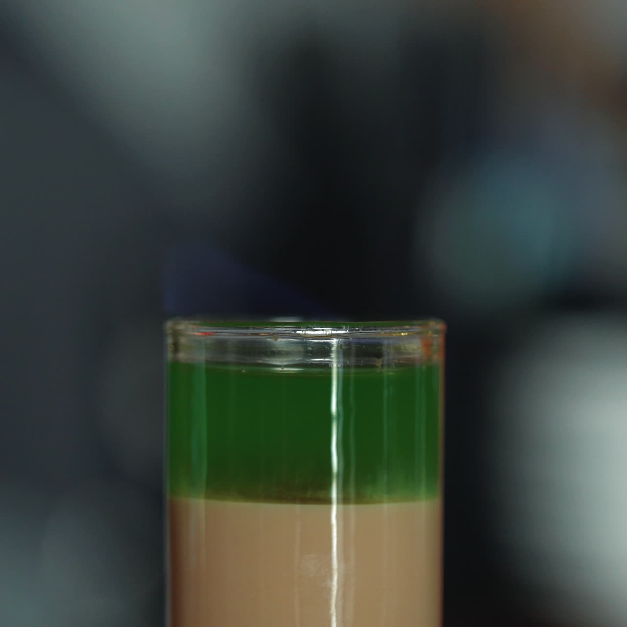 Barman prepares a cocktail and sets it on fire Sqare video