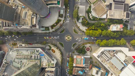 evening time nanjing city downtown traffic street crossroad circle aerial topdown timelapse panorama 4k china