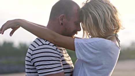 tender couple embracing in ocean