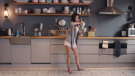 funny-woman-dancing-in-kitchen-loop-pouring-coffee-having-fun-dance-wearing-pajamas-at-home-happy-morning-routine