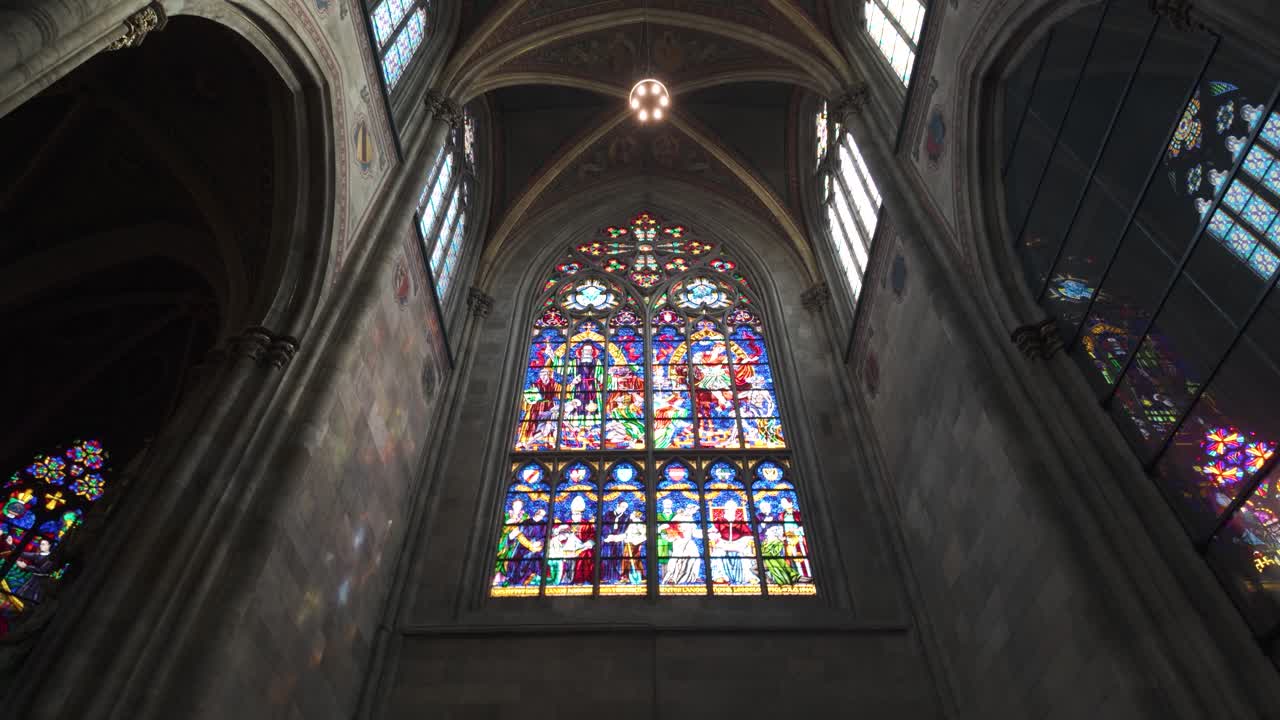 Chandelier view under vaulted ceilings inside Vienna's Votivkirche Church, Austria