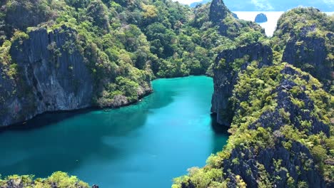 low flying aerial shot of big lagoon, small lagoon, el nido, palawan, philippines