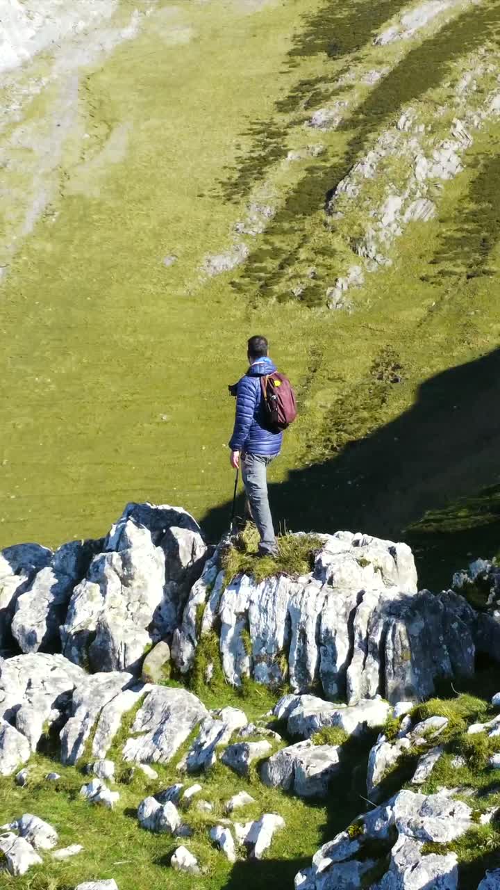 Man hiking on a rocky mountain landscape