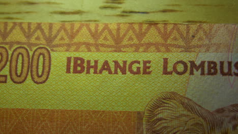 this is the macro view of a normal paper banknote- money- currency of 200 south african rand