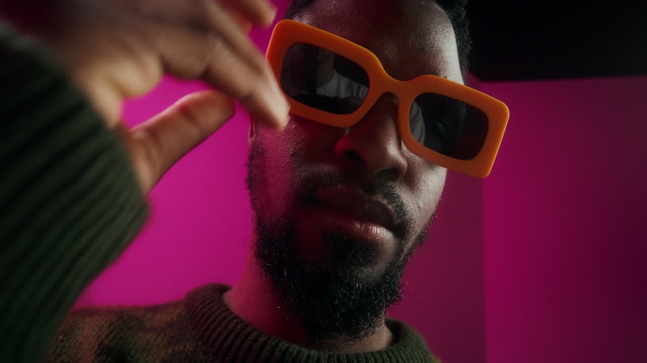 Stylish Man in Orange Sunglasses