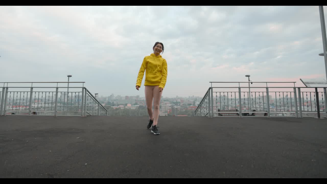 Woman working out outdoors in city