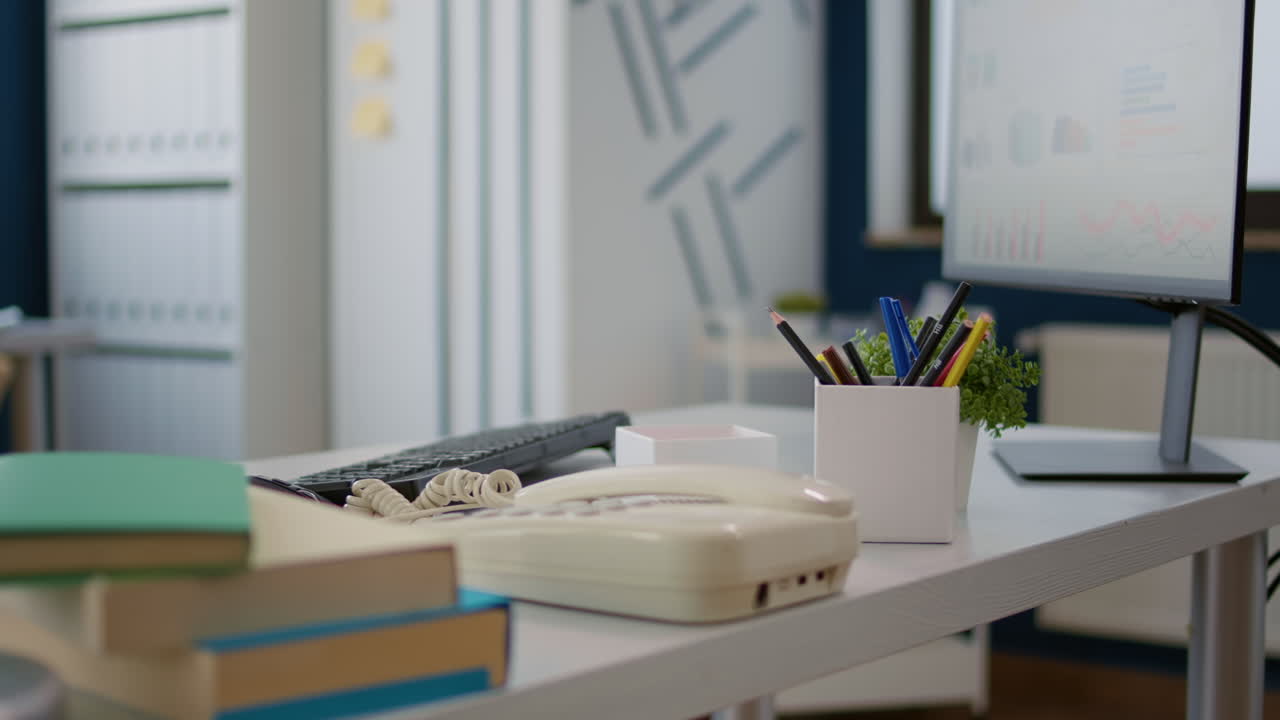Empty business workspace with office supplies and technology