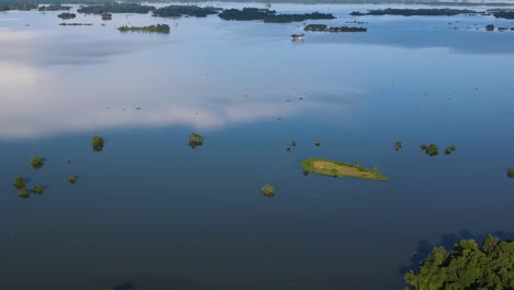 aerial tilt up view of large flooded rural landscape in sylhet