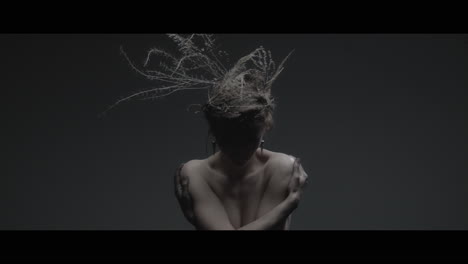 a woman dressed as mother nature rise her head