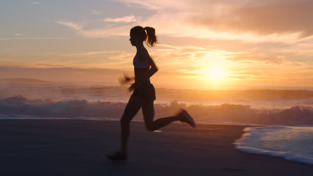 Active, fit female runner running alone