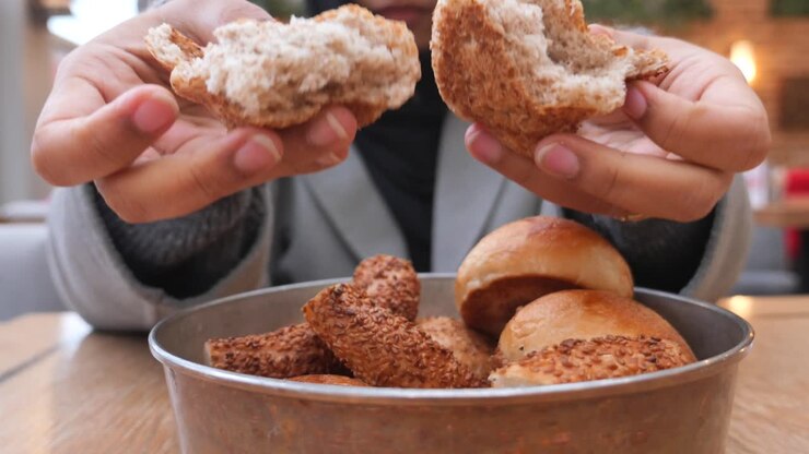 Woman eating bread