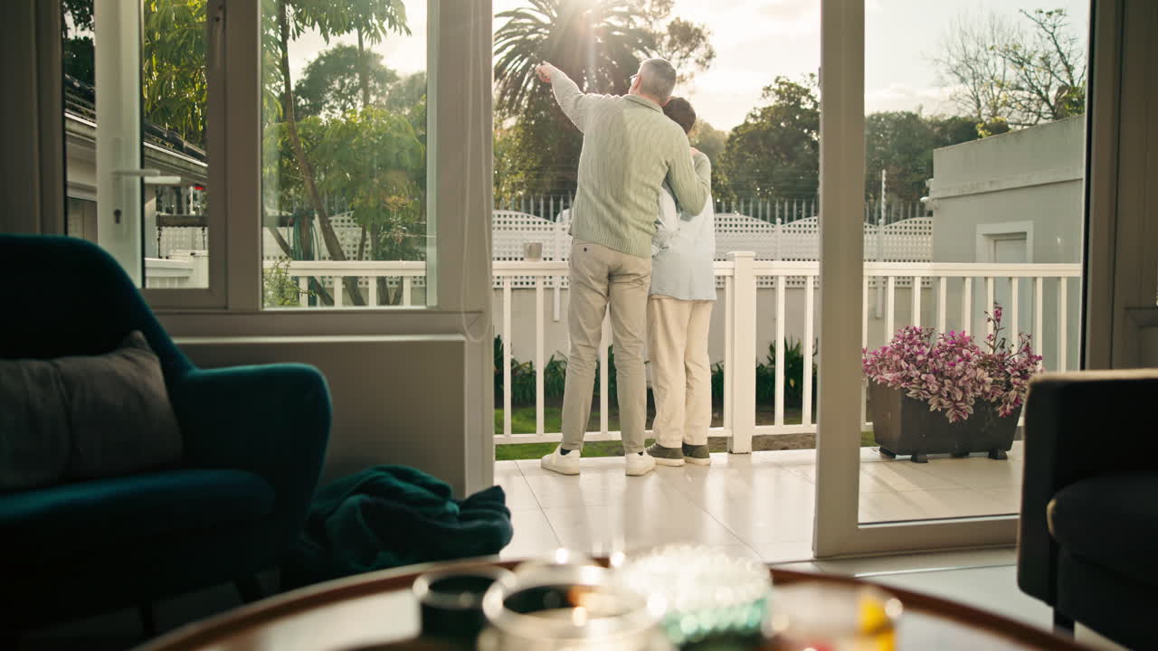 A senior couple enjoys a sunny day on their patio