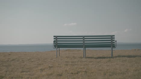 a bench with a view of the ocean near brenderup, denmark