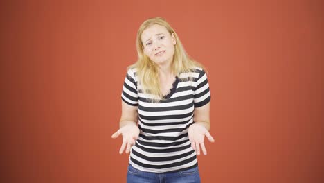 Woman-apologizing-looking-at-camera.