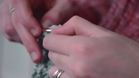 close up of woman hands crocheting