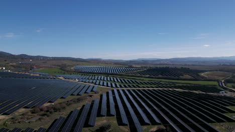 expansive solar panel array, rural portugal - aerial fly-over