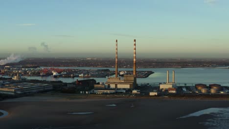 Aerial-tracking-shot-of-Dublin-Port-at-sunset