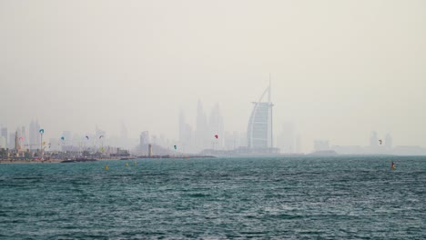 Kite-surfing-for-leisure-at-kite-beach-Dubai-against-the-famous-landmark-background