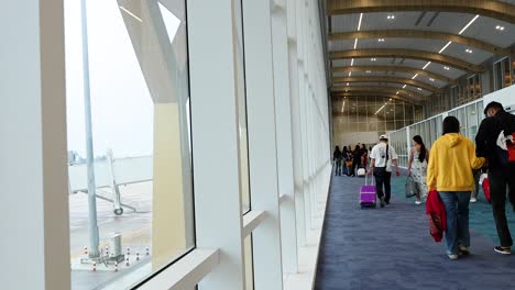 passengers moving through airport terminal in krabi