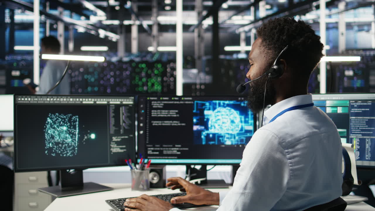 Data center employee talking in headset mic, coordinating technicians