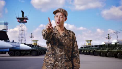 soldier pointing at military base