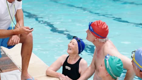 Swim-coach-interacting-with-seniors
