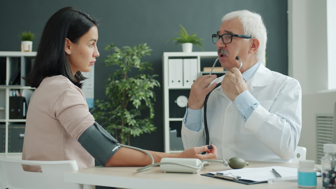 Doctor Examining Patient's Blood Pressure