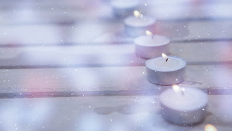 velas combinadas con la nieve que cae