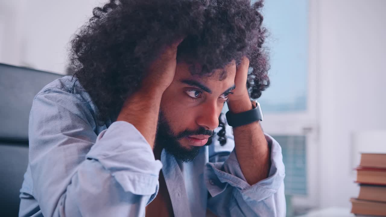 Upset middle eastern businessman stressed bad online news financial crisis