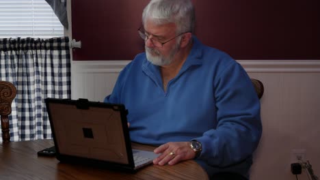 senior citizen upset and mad at using a computer and technology