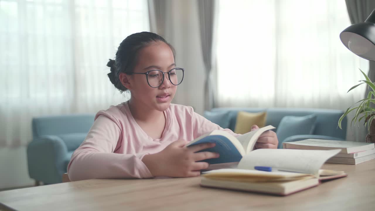 Asia Girl Reading Book At Living Room, Asian Child Learning At Home