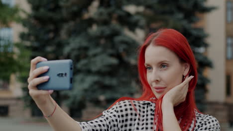 woman taking selfie in city