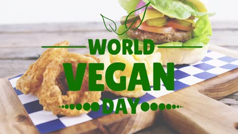 animation of world vegan day text over fresh hamburger