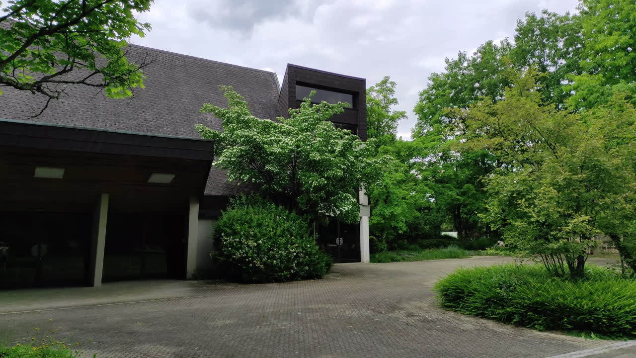 Exterior of mortuary building in Germany, panning shot.