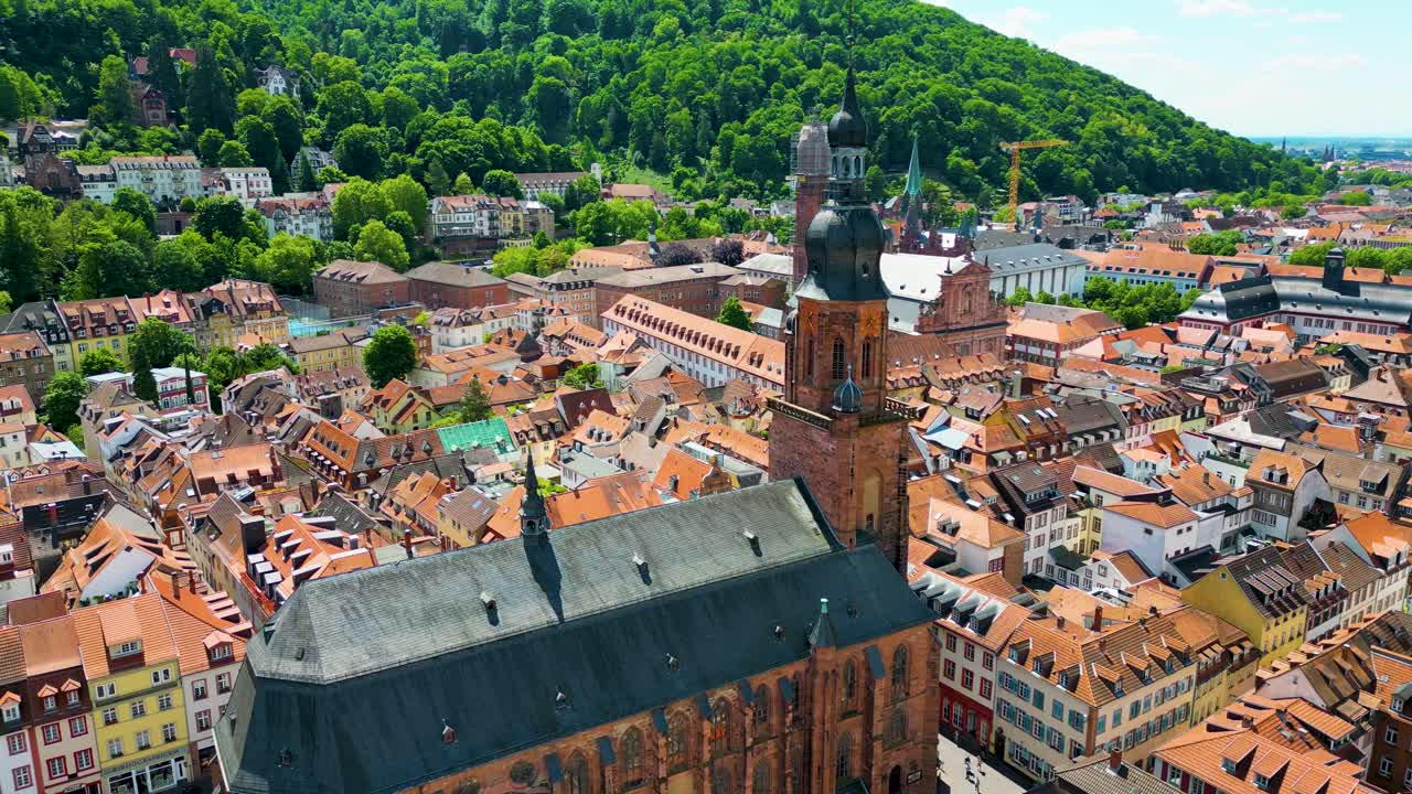 4K Aerial Drone Video of the Beautiful Heiliggeistkirche and Jesuitenkirche Churches along the Neckar River in Heidelberg, Germany