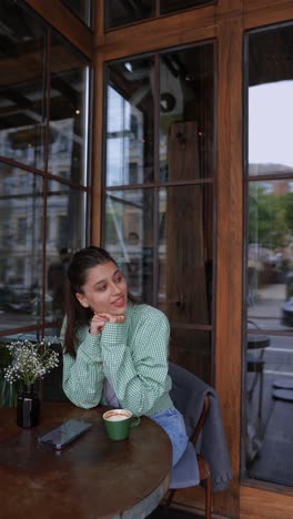 woman relaxing in a cafe with a coffee