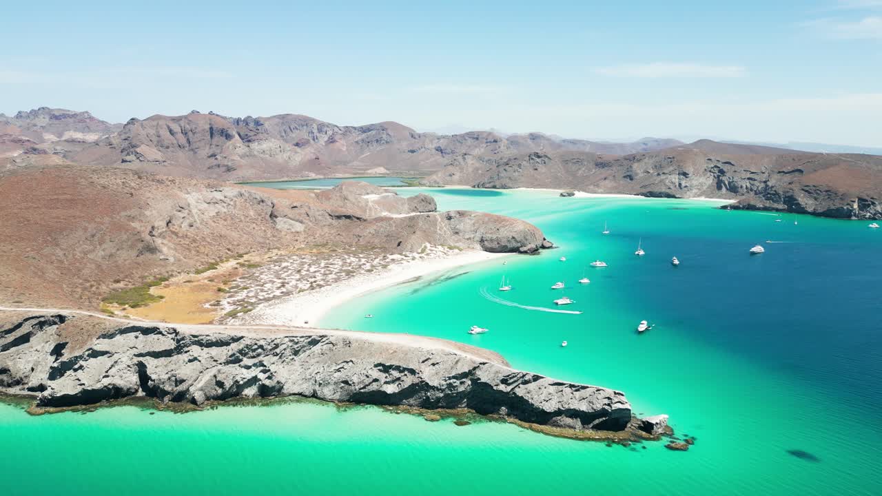 Tecolandra beach in la paz, mexico, showing clear blue waters and rocky coastline, aerial view