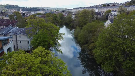 aerial lowering over the river avon in the centre of bath, england