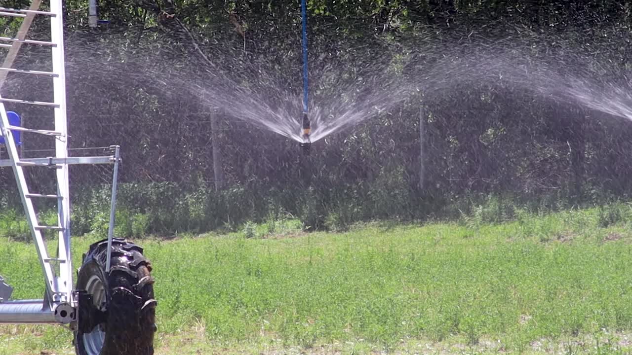 Automated farming irrigation sprayer punch in shot 4K 30FPS