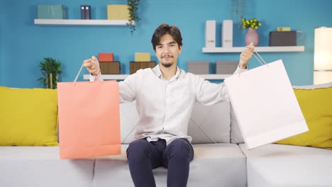 Man-looking-at-camera-with-shopping-bags.