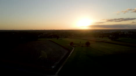 Aerial-of-sun-setting-over-a-peaceful-rural-landscape-in-the-Netherlands