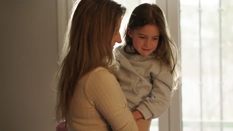 mother and daughter playing at home
